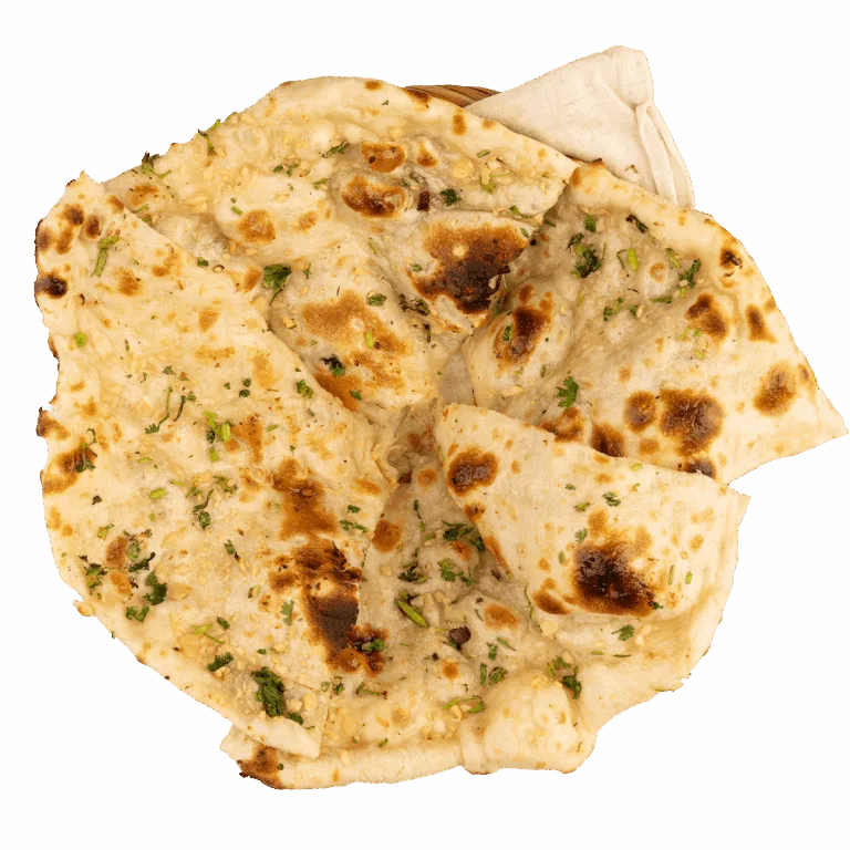 Garlic naan baked in a clay tandoor at Tikka Drive Chandler, AZ